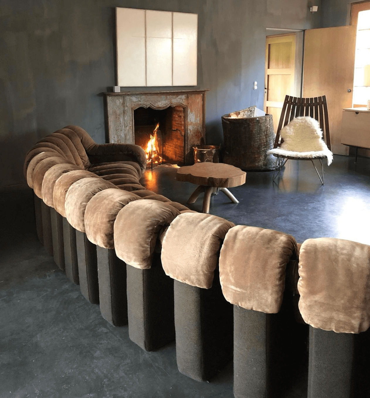 DS 600 modular sofa in front of fireplace